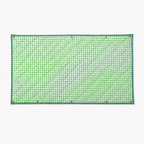 Quilted Cozie Dozie Co. Co-mpanion Swag Mat in green gingham featuring brass press studs against a white background.