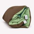 Rolled Cozie Dozie Co. Limited Edition Warrigal Greens Joey adventure lounger cover showing green gingham lining and canvas backing against a white background.