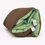 Rolled Cozie Dozie Co. Limited Edition Warrigal Greens Joey adventure lounger cover showing green gingham lining and canvas backing against a white background.